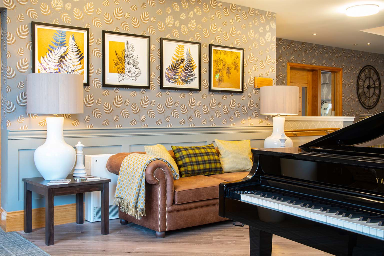 sofa next to a grand piano