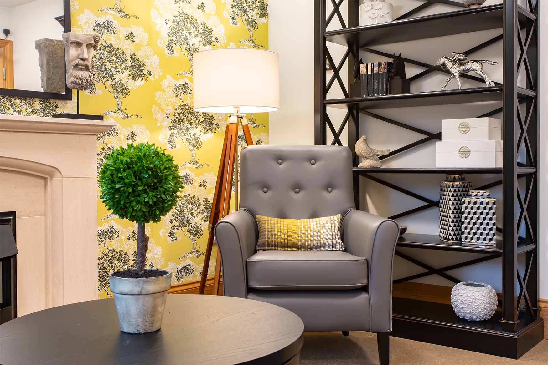 library area with comfy chair and bookshelf