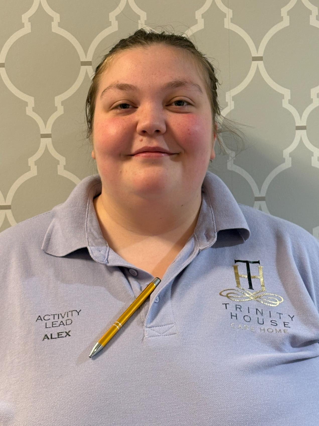 woman smiling in lilac polo shirt