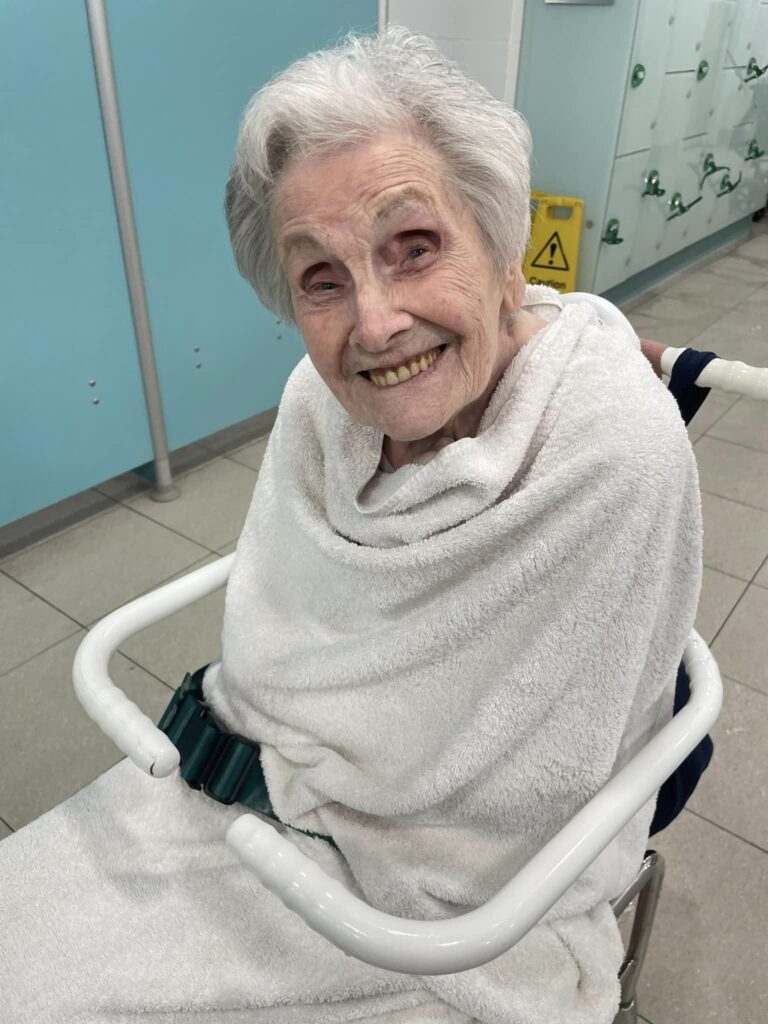 Elderly Woman Wrapped Up in Towel