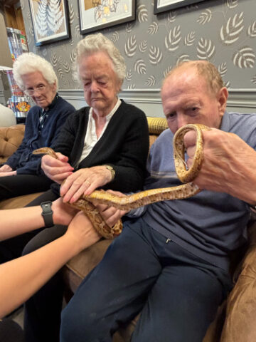 Celebrating World Animal Day at Trinity House with Zoo Lab's animals, and how interaction with animals benefits our residents.