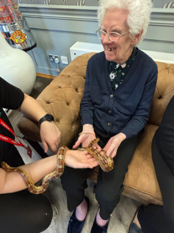 Celebrating World Animal Day at Trinity House with Zoo Lab's animals, and how interaction with animals benefits our residents.