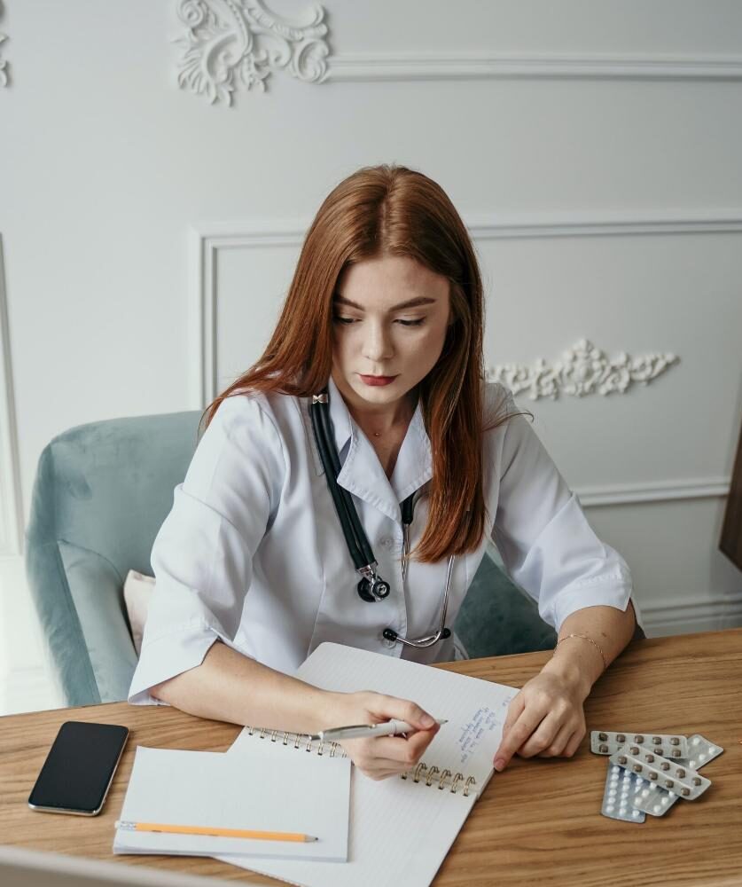 doctor writing a personalised care plan